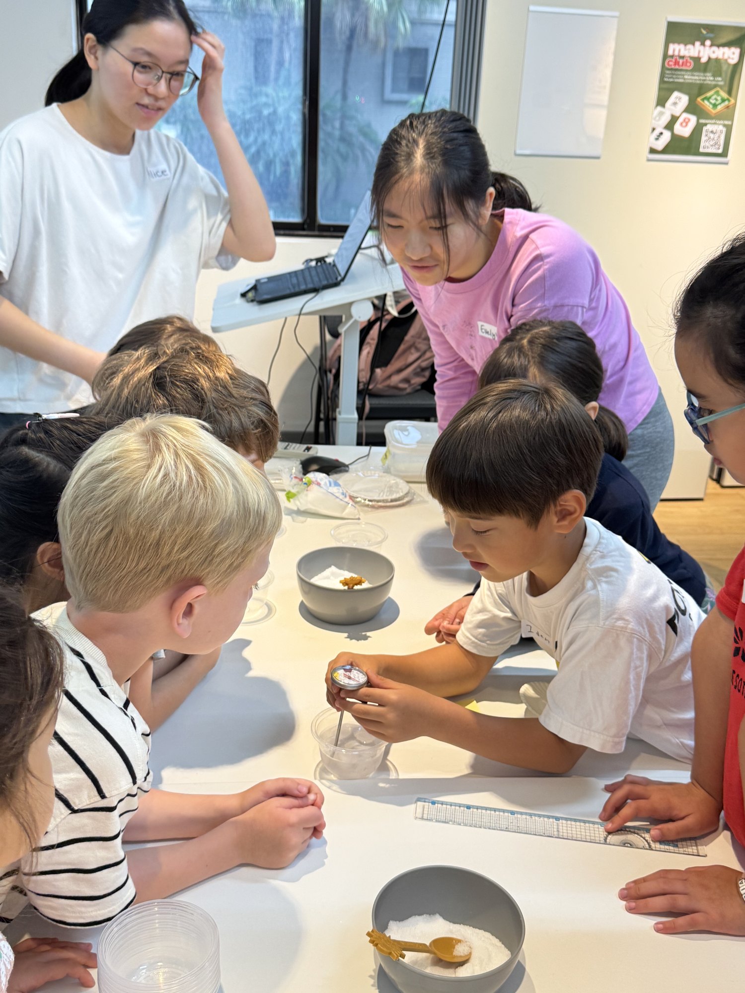 Young explorers working together with science mentors